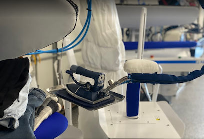 Inside Wheelers Hill Dry Cleaning & Laundry — pressing equipment and finishing room